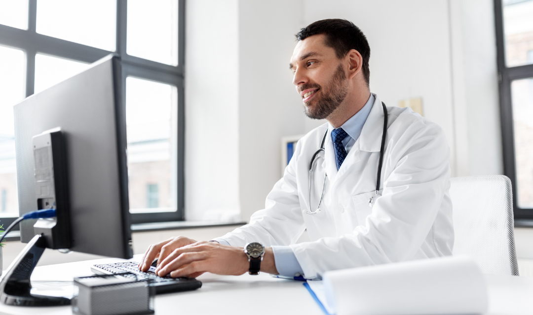 Provider at a desk typing