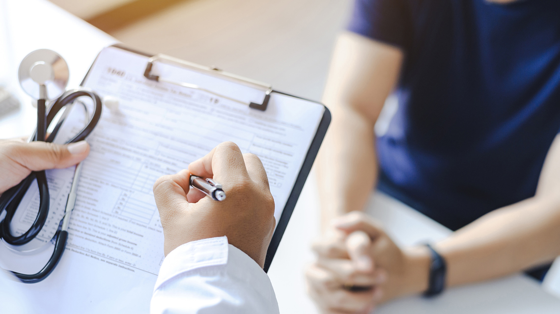 Provider taking patient notes